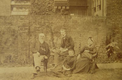 Dr. William R. Woodman with His Family at Their London Home by English Photographer